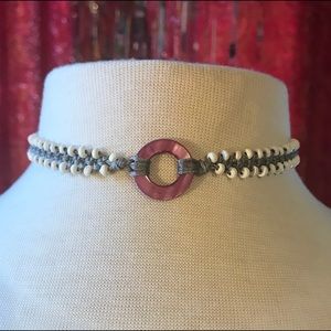 Chocker with purple mother of pearl donut bead.